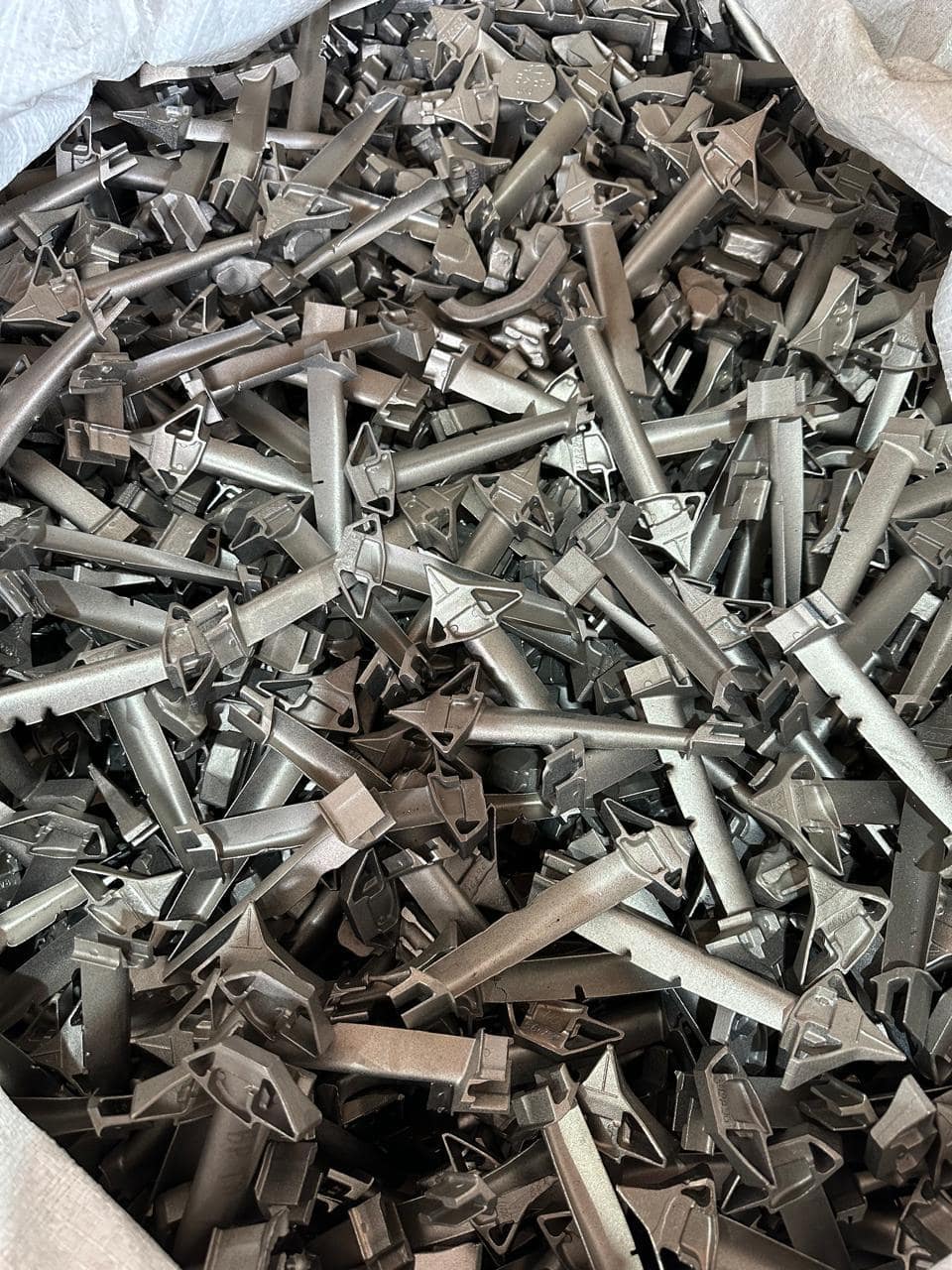 Cast alloy components in a bulk bag